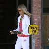 AnnaLynne McCord wearing a white Juicy Couture velour tracksuit leaving a hair salon in West Hollywood Los Angeles.