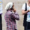 Aston Merrygold of JLS
shows off an Audi R8 sports car as he arranges to pay the parking fee over his mobile phone. 
London, England.