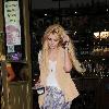 Mischa Barton leaves the Hawley Arms Pub in Camden carrying what appears to be a packaged food product.London.