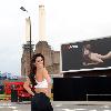 Kelly Brook arrives to unveil a billboard featuring her posing nude for Reebok's EasyTone trainers outside Battersea Power Station.
London, England.