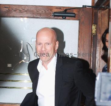 Bruce Willis with girlfriend Emma Heming
 Celebrities leaving Madeos restaurant in West Hollywood. 
Los Angeles, California.