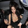 Amy Winehouse shows a bit more than she may have intended, as she arrives at the opening of Shaka Zulu bar, in Camden with her boyfriend Reg Traviss
London, England.