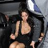 Amy Winehouse shows a bit more than she may have intended, as she arrives at the opening of Shaka Zulu bar, in Camden with her boyfriend Reg Traviss
London, England.