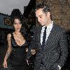 Amy Winehouse shows a bit more than she may have intended, as she arrives at the opening of Shaka Zulu bar, in Camden with her boyfriend Reg Traviss
London, England.