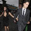 Amy Winehouse shows a bit more than she may have intended, as she arrives at the opening of Shaka Zulu bar, in Camden with her boyfriend Reg Traviss
London, England.