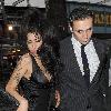 Amy Winehouse shows a bit more than she may have intended, as she arrives at the opening of Shaka Zulu bar, in Camden with her boyfriend Reg Traviss
London, England.