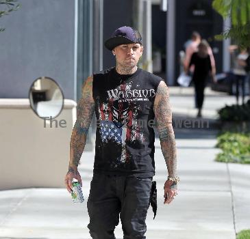 Benji Madden
 of the rock band 'Good Charlotte', wearing a sleeveless shirt showing off his tattoos
Los Angeles, California.