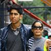 Dev Patel and girlfriend Frida Pinto out walking in London. The couple met while working together on the film 'Slumdog Millionaire', and more than a year since it swept the boards at the Academy Awards, the pair appear to be as close as ever. London. Dev Patel and girlfriend Frida Pinto out walking in London. The couple met while working together on the film 'Slumdog Millionaire', and more than a year since it swept the boards at the Academy Awards, the pair appear to be as close as ever. London.