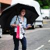 Helen Flanagan returns to the 'Coronation Street' set after shopping in the heavy rain.Manchester.