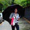 Helen Flanagan returns to the 'Coronation Street' set after shopping in the heavy rain.Manchester.