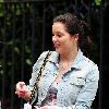 Helen Flanagan returns to the 'Coronation Street' set after shopping in the heavy rain.Manchester.