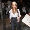 Tila Tequila seen shopping in Beverly Hills, sporting the injuries she received after being pelted with bottles during a recent festival performance.

{TILA TEQUILA} is taking legal action after she was allegedly hit with beer bottles and fire crackers while performing onstage at a music festival in Illinois.
Story body
The 28 year old, real name Tila Nguyen, claims she was injured during a prolonged attack when she was rapping at the Gathering of the Juggalos event, which began on Thursday (12Aug10).
Police are investigating the incident, which is said to have left the reality TV star's face bruised and bloodied - and now Tequila has consulted lawyers to take action against the perpetrators of the attack.
In a post on her personal Twitter.com page, she writes,