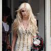 Sixteen year old Taylor Momsen leaving The George Pub, clutching two packs of Malboro Gold cigarettesTaylor Momsen from rock group The Pretty Reckless packs a lot into her day, as she promotes her bands debut album release. She leaves her hotel at 10.45am, holding a Starbucks Coffee, and wearing the same outfit that she wore onstage at the o2 Academy the evening before, minus the black stockings! Taylor and the band head to the 'This Morning' studios for an interview, and a performance of her bands latest single, before heading to a traditional East End Pub in Shadwell, The George Tavern.  She spent around three hours inside the venue, and even had her driver bring her a fast food lunch. Taylor eventually left at 4pm adding her black stockings to her outfit, and headed to an interview for 'The 5.19 Show' and then made a surprise appearance at the band's album listening party, in Soho. Finally she conducted a live 'Ustream' broadcast, before finally returning to her hotel, for a well earned rest!London.