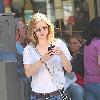 Kelli Garner 
while she was shopping with her parents at the Grove, Kelli
took a photo of herself on a poster advertising her new show