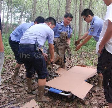 Woman saved from mud pit Woman saved from mud pit