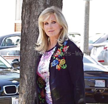 Morgan Fairchild 
walking in Beverly Hills wearing a black sweater
Los Angeles, California.