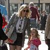 Geri Halliwell with Bluebell Madonna after lunch at a restaurant. Geri sporting a grey blazer, shirt and tie, shorts and boots, as she strolls about with her daughter in central London. London.