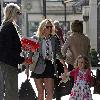 Geri Halliwell with Bluebell Madonna after lunch at a restaurant. Geri sporting a grey blazer, shirt and tie, shorts and boots, as she strolls about with her daughter in central London. London.