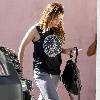 Hilary Duff newlywed arriving at a pilates studio in Toluca Lake wearing a peace sign t-shirt Los Angeles.