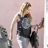 Hilary Duff newlywed arriving at a pilates studio in Toluca Lake wearing a peace sign t-shirt Los Angeles.