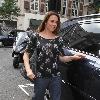 Melanie Chisholm aka Mel C arrives at the Radio One studios with her jeans rolled up on one leg. London.