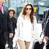 Eva Longoria is seen in good spirits as she arrives at Heathrow Airport. London.