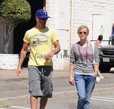 Reese Witherspoon and Jim Toth returning to their car after having lunch at Sugar FISH Sushi together. Los Angeles.