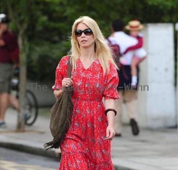 Claudia Schiffer 
looking fantastic in a summer dress, after dropping her children off at school. The supermodel has shifted the baby weight after delivering her third child in May.
London, England.