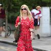 Claudia Schiffer 
looking fantastic in a summer dress, after dropping her children off at school. The supermodel has shifted the baby weight after delivering her third child in May.
London, England.