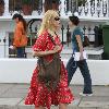 Claudia Schiffer 
looking fantastic in a summer dress, after dropping her children off at school. The supermodel has shifted the baby weight after delivering her third child in May.
London, England.