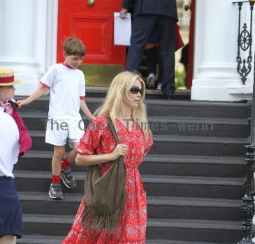 Claudia Schiffer 
looking fantastic in a summer dress, after dropping her children off at school. The supermodel has shifted the baby weight after delivering her third child in May.
London, England.