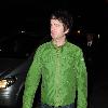 Noel Gallagher wearing a bright green jacket, arrives back at the Radisson Edwardian Hotel after watching Blue Moon Rising Premier
Manchester, England.