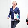 Renee Zellweger running errands in Santa Monica wearing zip-up fleece and sweats. Los Angeles.