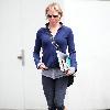 Renee Zellweger running errands in Santa Monica wearing zip-up fleece and sweats. Los Angeles.