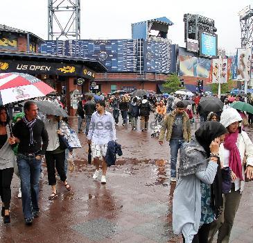 Fans brave the rain at the USTA Arthur Ashe Stadium in Flushing, Queens.
The US Open men's tennis final championship match between top-seeded Rafael Nadal and third-seeded Novak Djokovic has been rescheduled at 4 p.m. on Monday, 13 September, because of rain. New York City, USA.