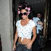 Katie Price aka Jordan
 leaving the Soho hotel with her hair rolled up in pink hair curlers. 
London, England.