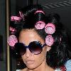 Katie Price aka Jordan
 leaving the Soho hotel with her hair rolled up in pink hair curlers. 
London, England.