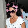 Katie Price aka Jordan
 leaving the Soho hotel with her hair rolled up in pink hair curlers. 
London, England.