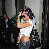 Katie Price aka Jordan
 leaving the Soho hotel with her hair rolled up in pink hair curlers. 
London, England.