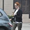 Christina Hendricks 'Mad Men' star Christina Hendricks toned down her glamorpuss image and turned plain Jane during a trip out in Los Angeles. The stunning redhead kept her famous curves under wraps when she stepped out  in a ripped t-shirt, skinny jeans and flip-flops with her hair tied back in a simple bun. Hendricks, noted for her incredible hourglass figure as acting skills, has delighted millions of women around the world who are fed up with seeing stick-thin actresses on TV and the big screen.