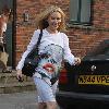 Kylie Minogue wearing a striking graphic print dress London.