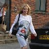 Kylie Minogue wearing a striking graphic print dress London.