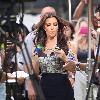 Kim Kardashian using a fan and drinking water while filming an interview for the entertainment television news programme 'Extra' at The Grove in Hollywood
Los Angeles, California.