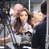 Kim Kardashian using a fan and drinking water while filming an interview for the entertainment television news programme 'Extra' at The Grove in Hollywood
Los Angeles, California.