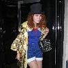 Paloma Faith wearing a Top hat, gold cape and ruby shoes leaves La Caprice after dining with Jools Holland and friends. London.