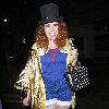 Paloma Faith wearing a Top hat, gold cape and ruby shoes leaves La Caprice after dining with Jools Holland and friends. London.