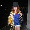 Paloma Faith wearing a Top hat, gold cape and ruby shoes leaves La Caprice after dining with Jools Holland and friends. London.