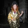 Paloma Faith wearing a Top hat, gold cape and ruby shoes leaves La Caprice after dining with Jools Holland and friends. London.