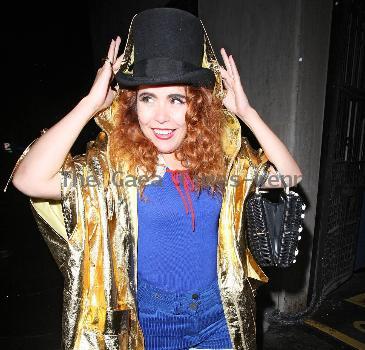 Paloma Faith wearing a Top hat, gold cape and ruby shoes leaves La Caprice after dining with Jools Holland and friends. London.