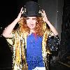 Paloma Faith wearing a Top hat, gold cape and ruby shoes leaves La Caprice after dining with Jools Holland and friends. London.